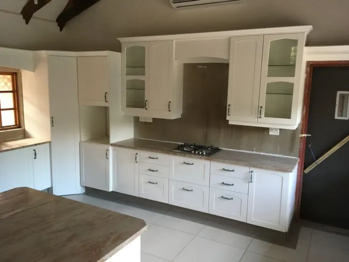 Built-in kitchen cabinetry with glass doors.